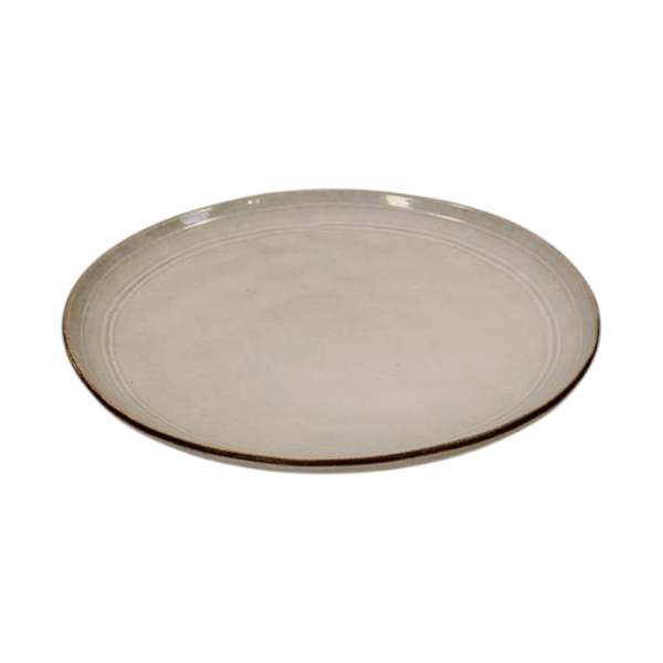 Four Candle Satchville stoneware dinner plate in off-white with a rustic brown rim on a white wooden table.